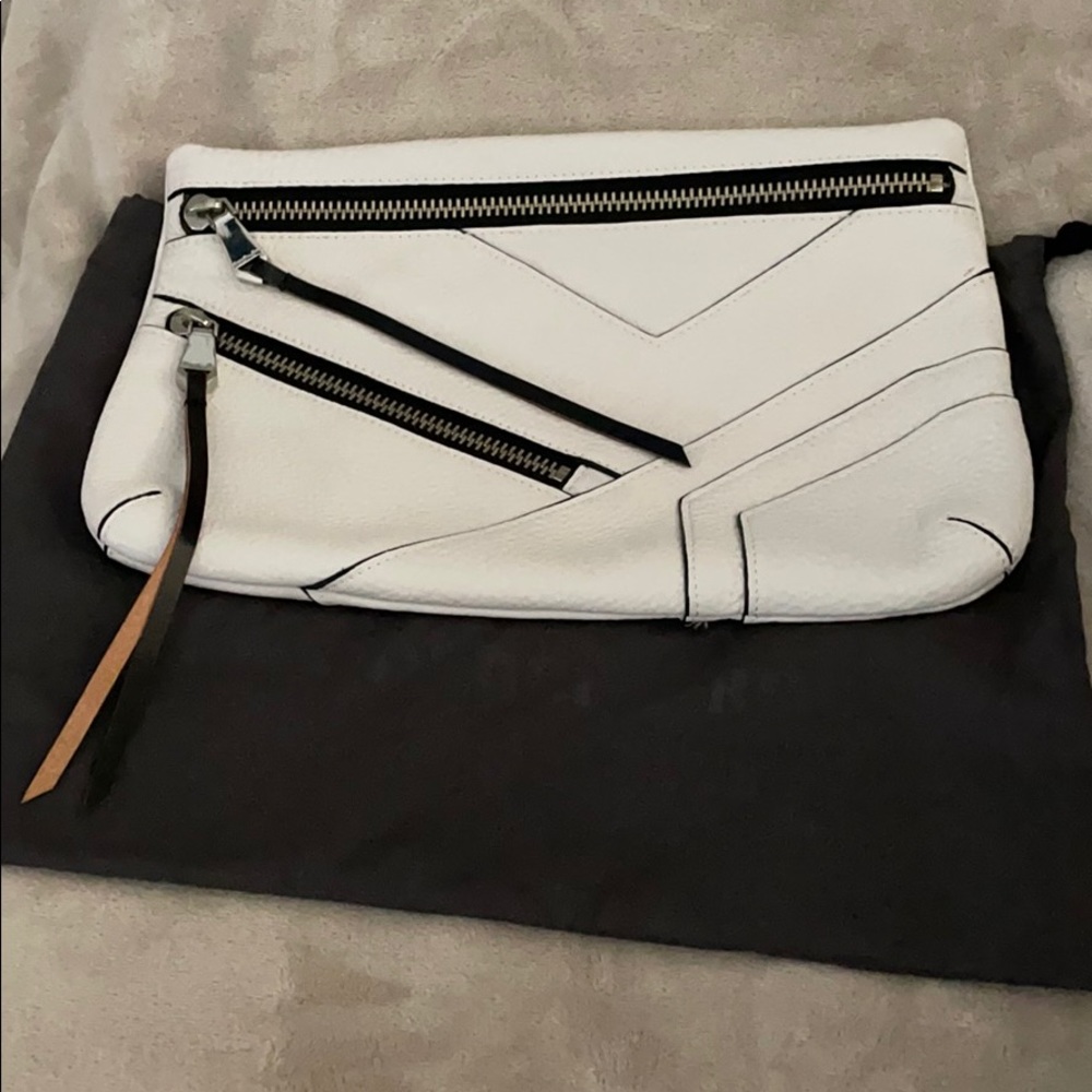 Christopher Kon white and black leather clutch.